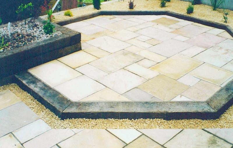 Indian Sandstone Paving with a Sleeper Edge designed by Kilmore Landscapes
